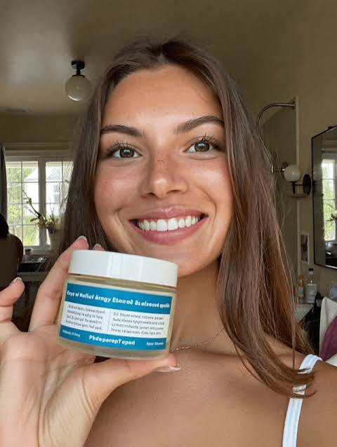 Creator holding a product jar to camera